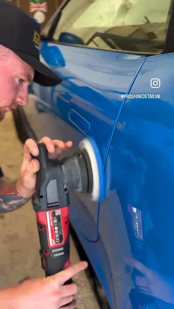 Close-up of the Proshine founder machine polishing blue vehicle bodywork