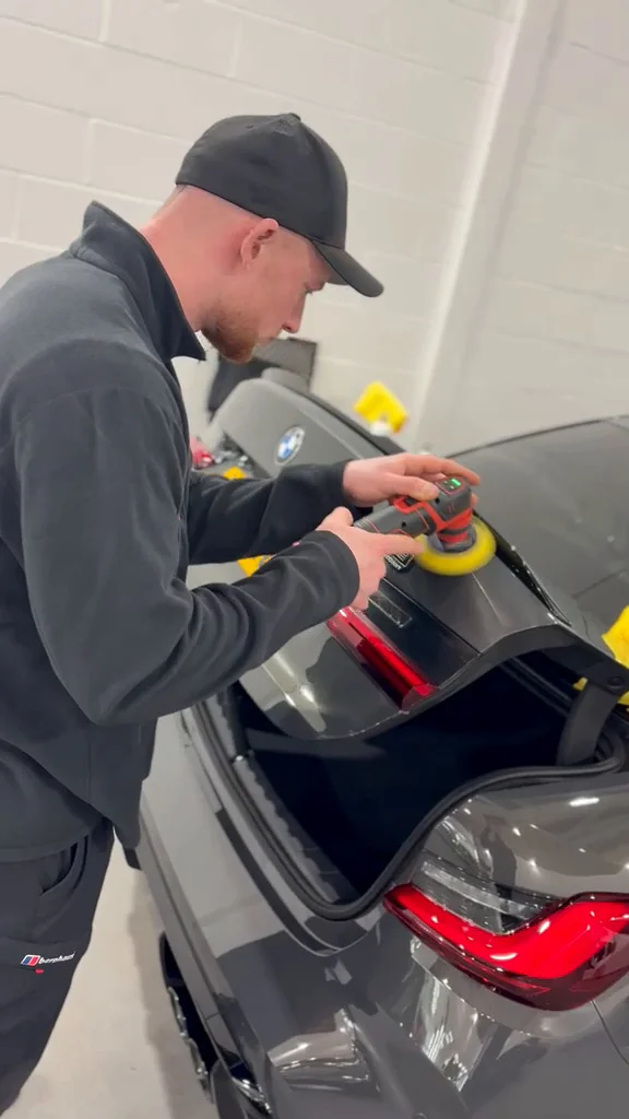 Proshine founder machine polishing a grey vehicle’s rear panel